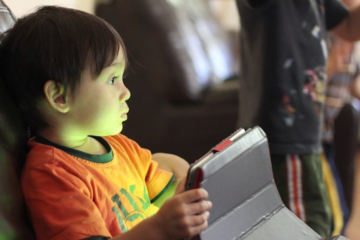 kid playing tablet