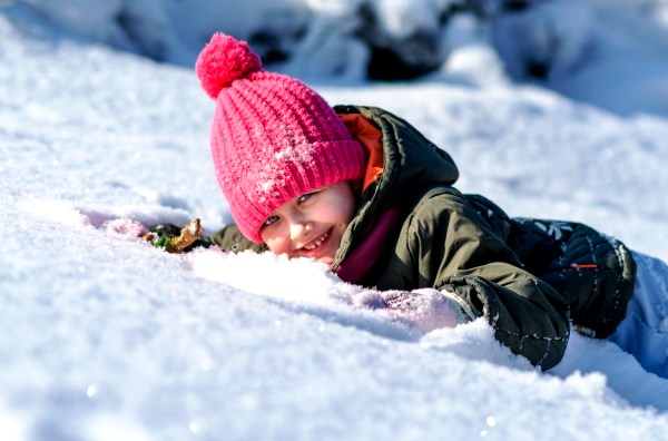 Child Playing in Snow