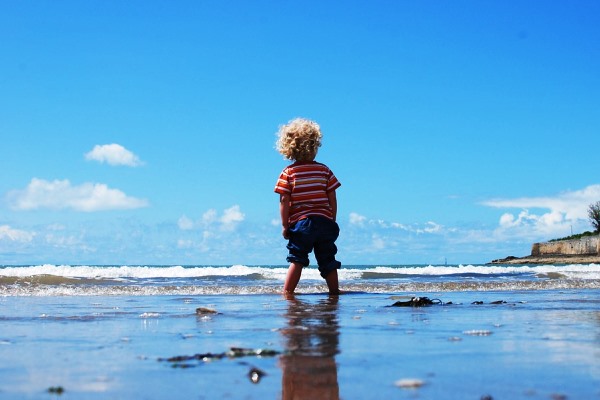 Child Walking on Sand