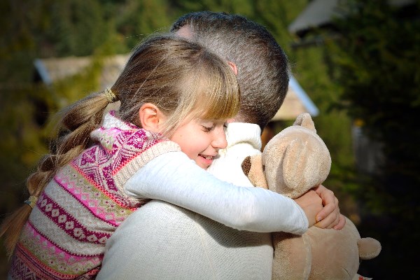 Child Hugging Parent