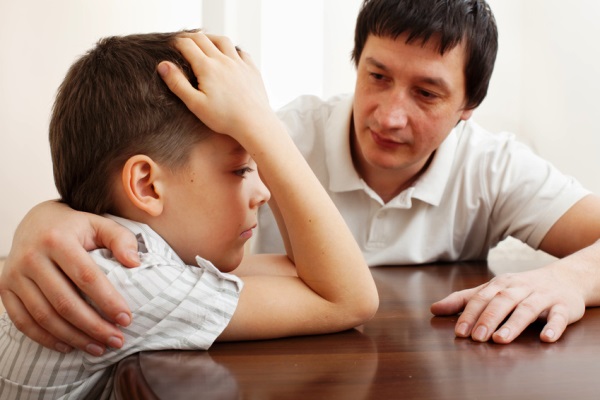 Father Comforting Sad Child